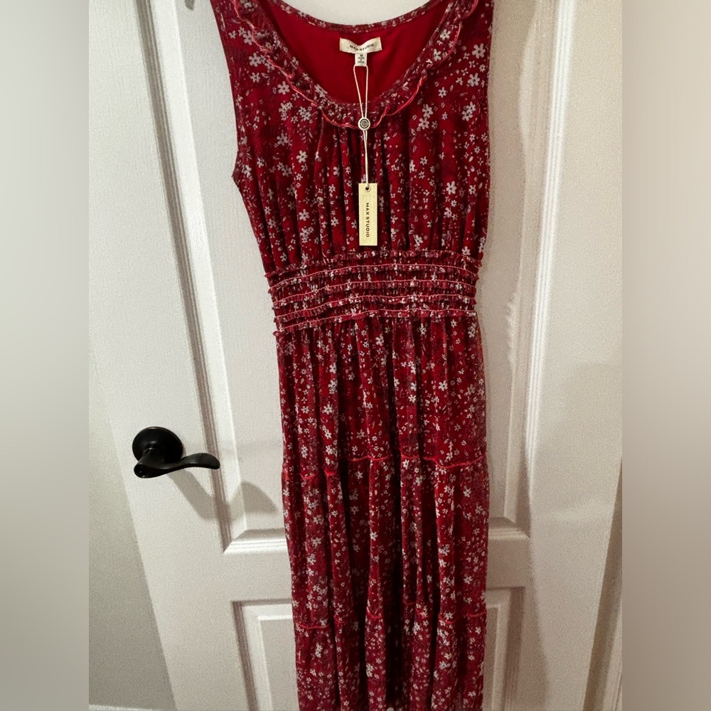 Red floral dress and is stretch at the waist line. Along with Soft material